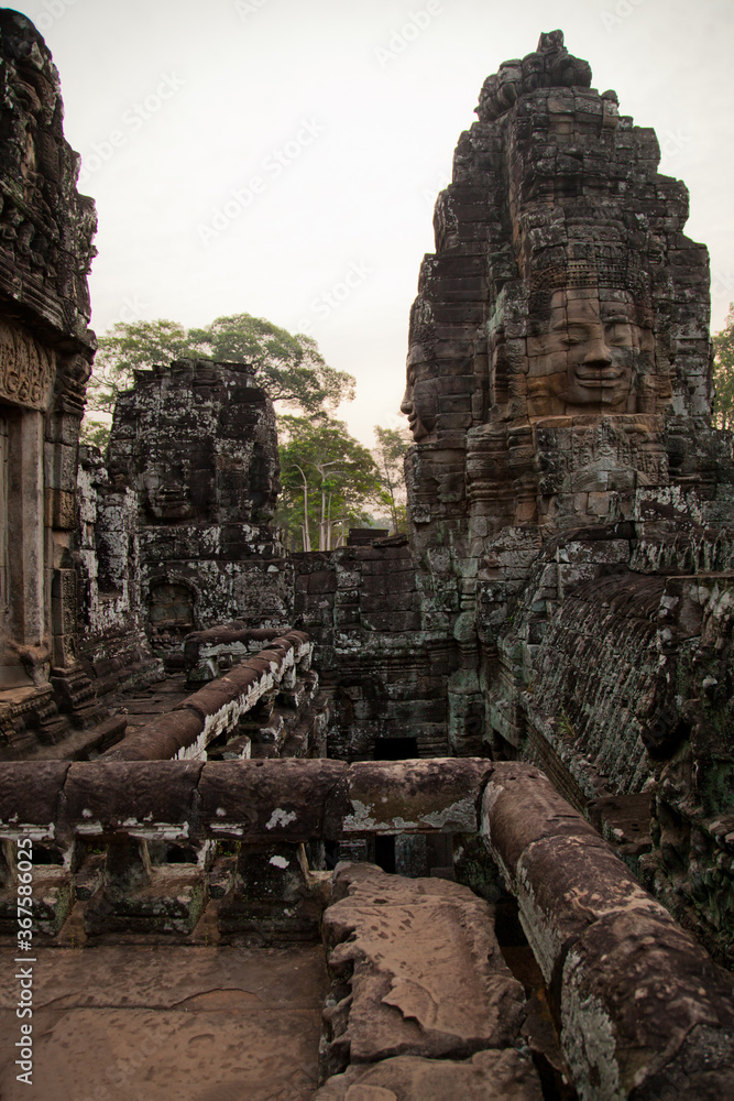 Fototapeta premium Stone murals and sculptures at Bayon Temple in daylight, Angkor Wat, Cambodia