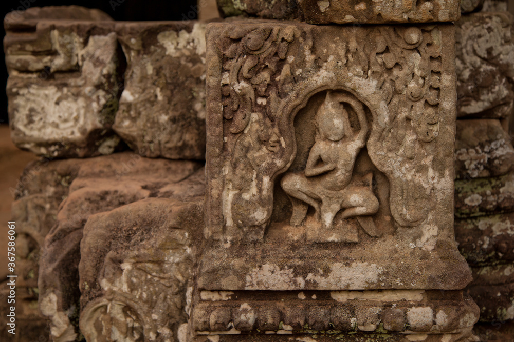 Stone murals and sculptures at Bayon Temple in daylight, Angkor Wat, Cambodia