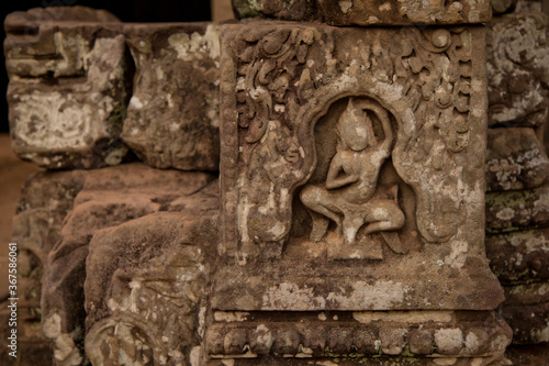 Stone murals and sculptures at Bayon Temple in daylight  Angkor Wat  Cambodia