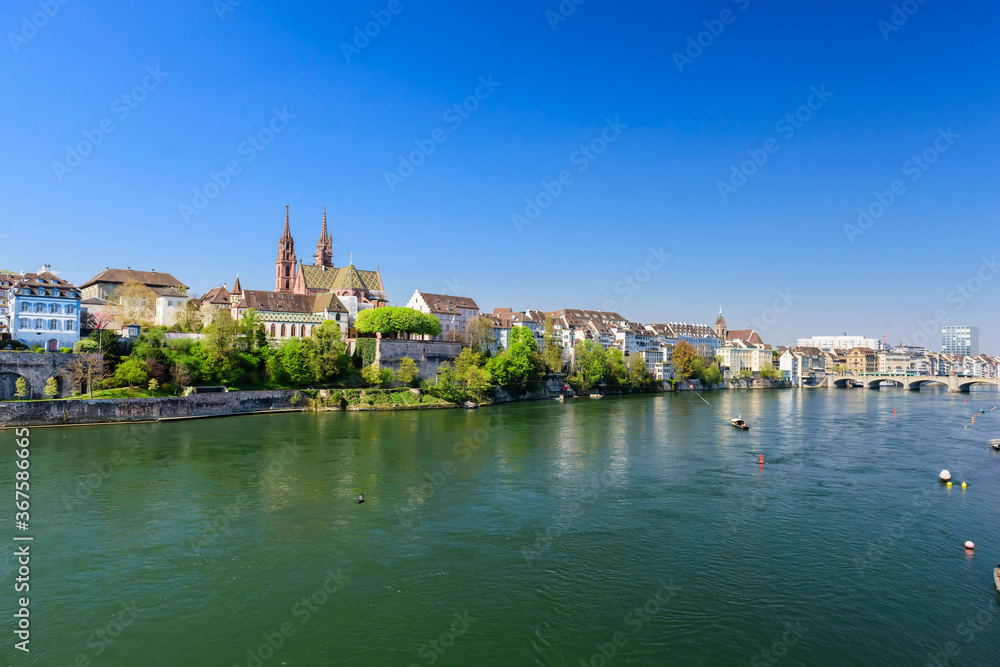 View of the River Rhine, the old part of the city of Basel and the Basel Minster Cathedral. Switzerland