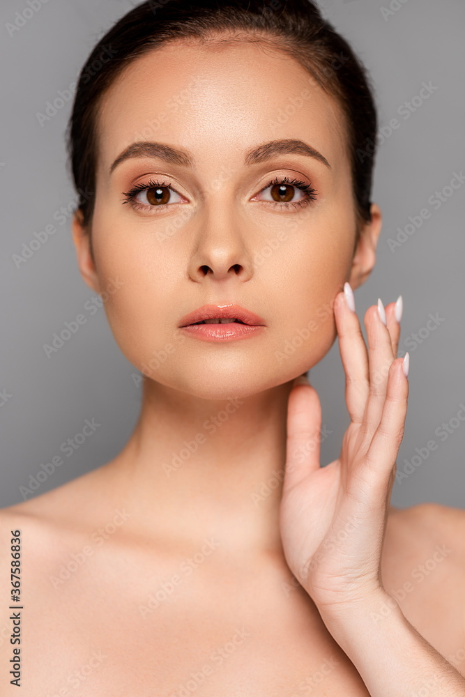 beautiful naked woman with perfect skin touching face isolated on grey beautiful naked woman with perfect skin touching face isolated on grey
