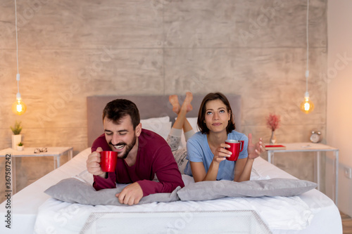Couple having coffee in bed © Impact Photography