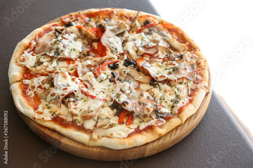 Delicious fresh pizza with olives on table outdoors