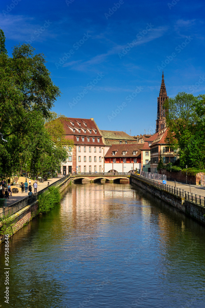 View from the bridge to the canal, embankment and architecture of Strasbourg, Alsace, France