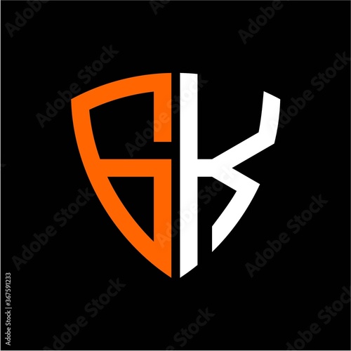 G K initials white orange shield with black background