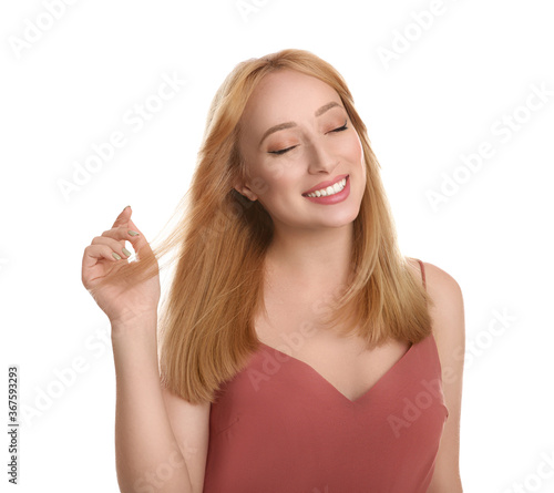 Portrait of beautiful young woman with blonde hair on white background