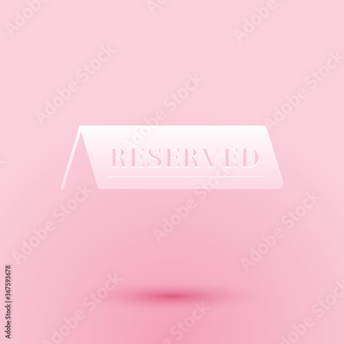 Paper cut Reserved icon isolated on pink background. Paper art style. Vector.