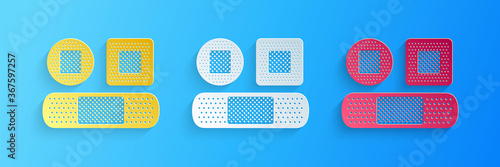 Paper cut Set Bandage plaster icon isolated on blue background. Medical plaster, adhesive bandage, flexible fabric bandage. Paper art style. Vector.