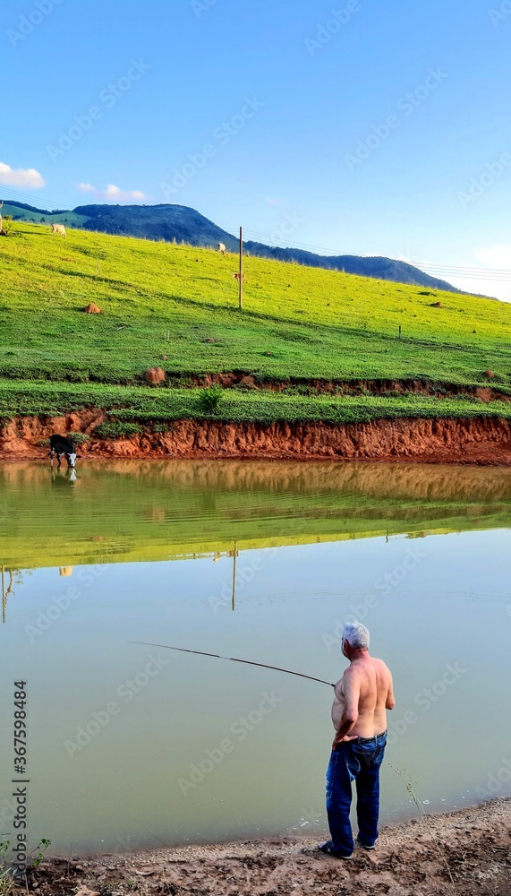 Naklejka premium fisherman on the river