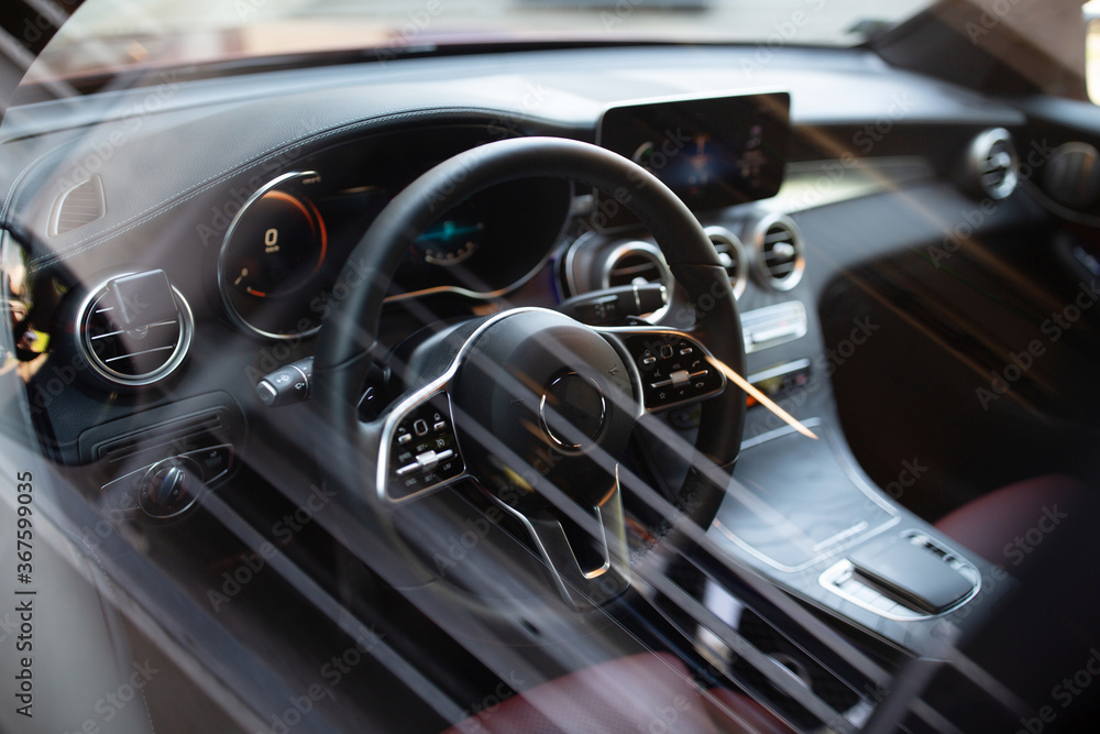 Car interior with white leather seats and dashboard