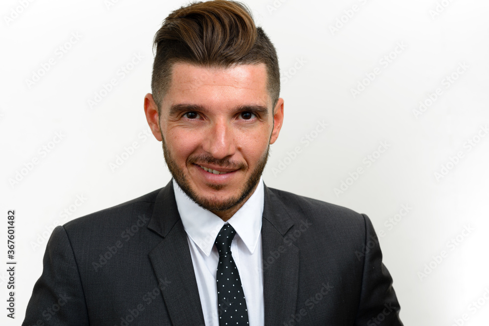 Portrait of handsome bearded Hispanic businessman in suit Portrait of handsome bearded Hispanic businessman in suit