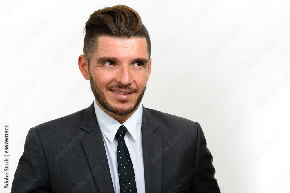 Portrait of handsome bearded Hispanic businessman in suit Portrait of handsome bearded Hispanic businessman in suit