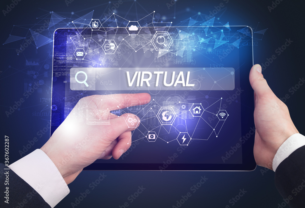 Obraz premium Close-up of a tablet searching VIRTUAL inscription, hi-tech computing concept