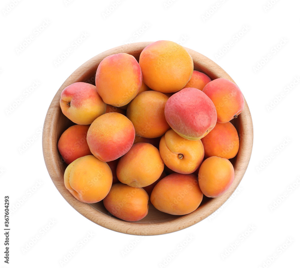 Delicious ripe apricots in wooden bowl isolated on white, top view Delicious ripe apricots in wooden bowl isolated on white, top view