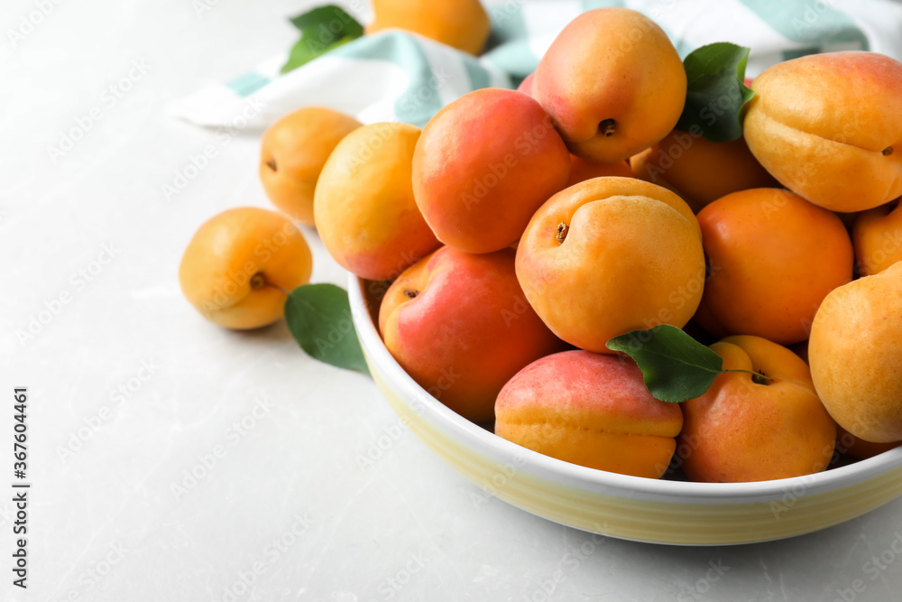 Delicious fresh ripe apricots on white table, closeup Delicious fresh ripe apricots on white table, closeup