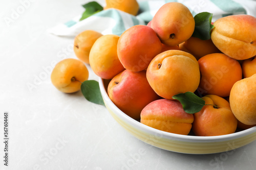 Delicious fresh ripe apricots on white table  closeup