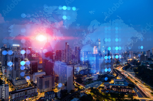Photography Hologram of Earth planet map on night panoramic cityscape of Kuala Lumpur, Malaysia, Asia