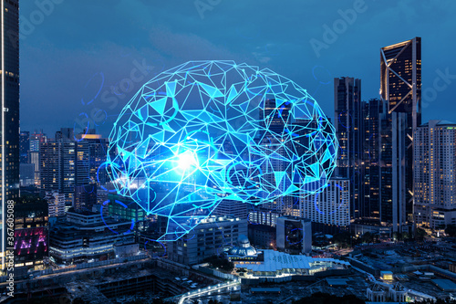 Human brain hologram, aerial panoramic city view of Kuala Lumpur at night. KL is the educational cluster in Malaysia, Asia. The concept of artificial intelligence. Double exposure.