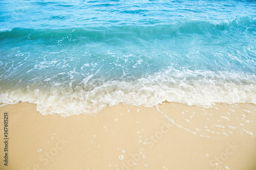 Sea waves rolling on beautiful sandy beach. Summer vacation