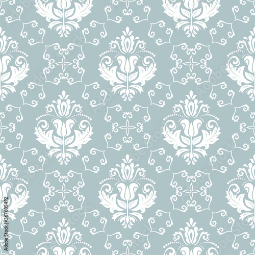 Classic seamless pattern. Damask orient ornament. Classic vintage light blue and white background. Orient ornament for fabric, wallpaper and packaging
