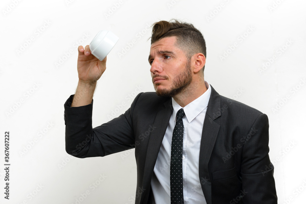 Portrait of handsome bearded Hispanic businessman in suit Portrait of handsome bearded Hispanic businessman in suit
