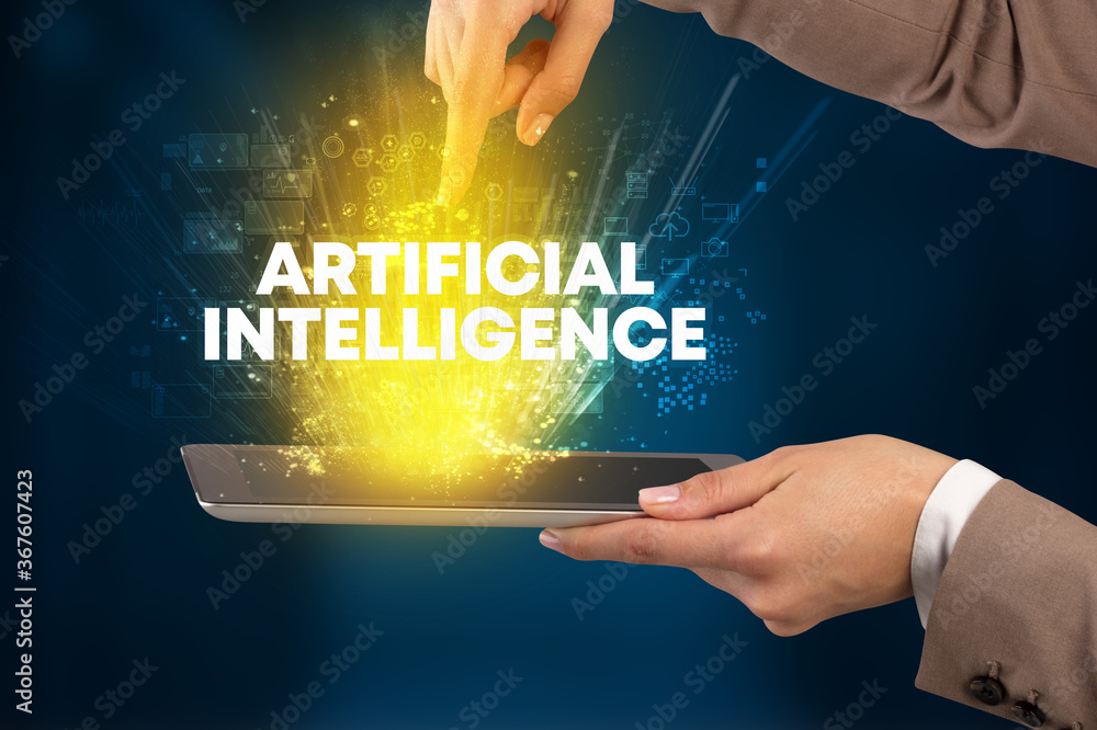 Close-up of a touchscreen with ARTIFICIAL INTELLIGENCE inscription, innovative technology concept