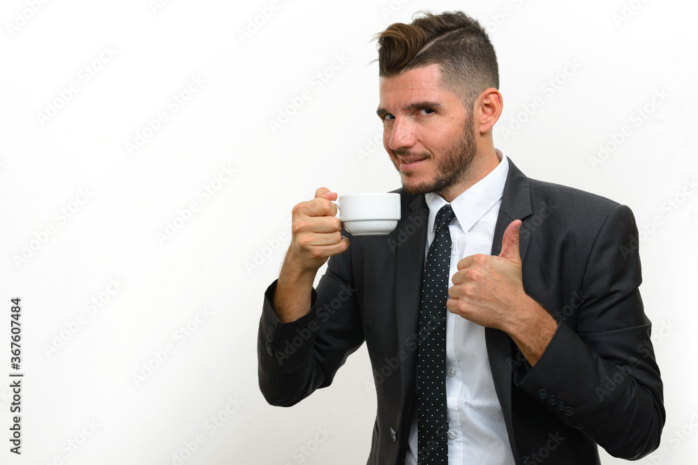 Portrait of handsome bearded Hispanic businessman in suit Portrait of handsome bearded Hispanic businessman in suit