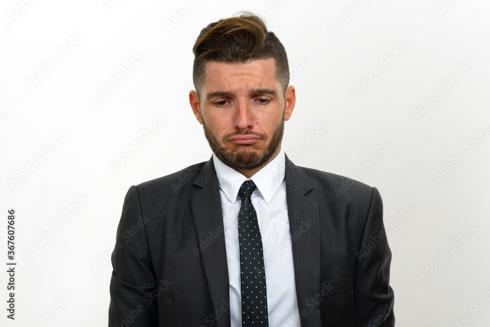 Portrait of handsome bearded Hispanic businessman in suit Portrait of handsome bearded Hispanic businessman in suit