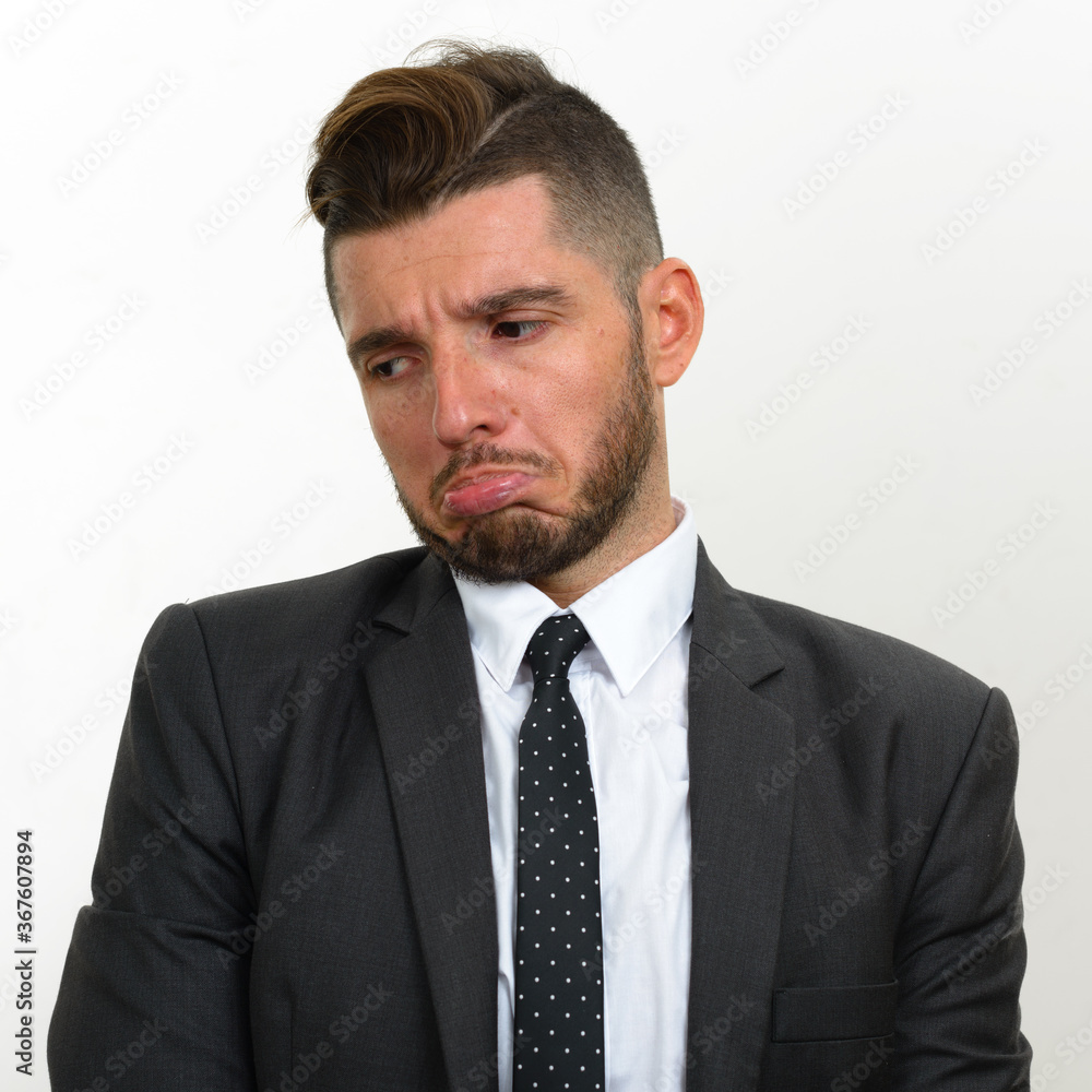 Portrait of handsome bearded Hispanic businessman in suit Portrait of handsome bearded Hispanic businessman in suit