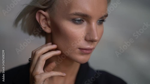 pretty effeminate man model face with makeup, closeup portrait of gay, androgynous model photo