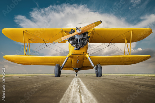 historical biplane on a runway photo
