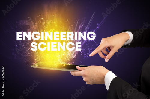 Close-up of a touchscreen with ENGINEERING SCIENCE inscription, innovative technology concept