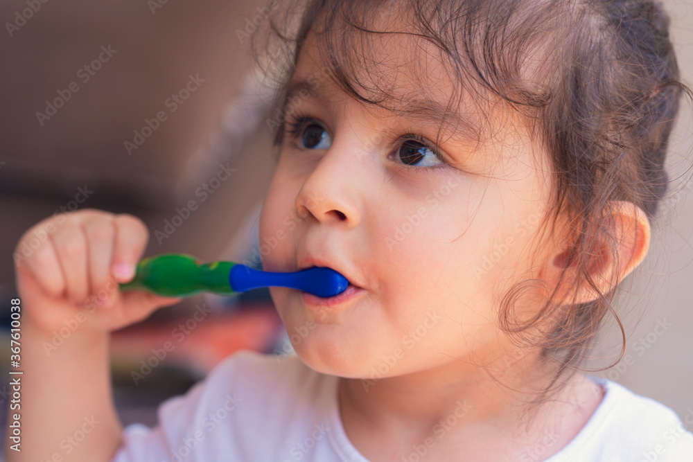 Dental hygiene. Happy little girl brushing her teeth Dental hygiene. Happy little girl brushing her teeth