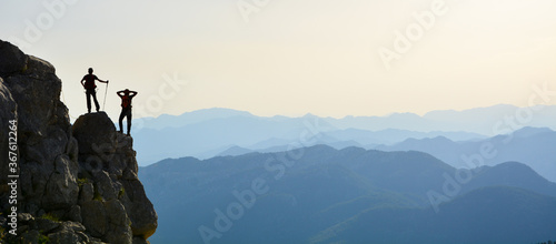 Silhouette of a man on the top of the mountain © Silhouette Media