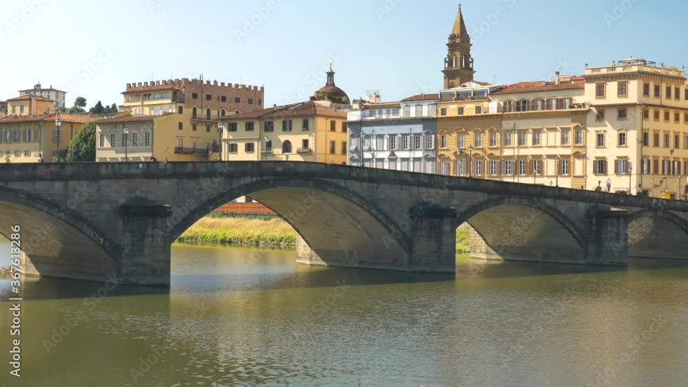 A bridge (Ponte alla Carraia) over the Arno river, in a summer morning.