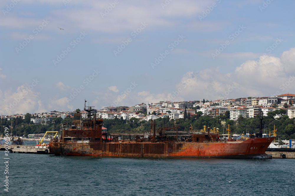 Old rusty ship. Istanbul city view.