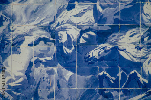 Closeup of the blue mosaic of the facade of the Carlos Lopes pavilion located in the Eduardo VII park of Lisbon, the hilly coastal capital city of Portugal
 photo