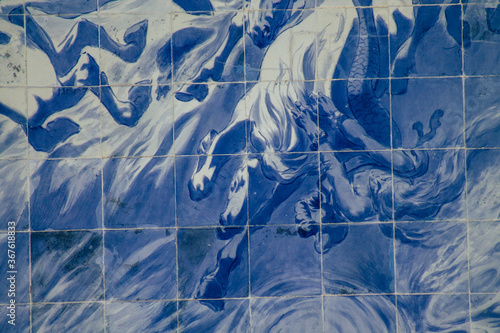 Closeup of the blue mosaic of the facade of the Carlos Lopes pavilion located in the Eduardo VII park of Lisbon, the hilly coastal capital city of Portugal
 photo