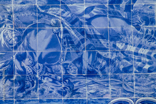 Closeup of the blue mosaic of the facade of the Carlos Lopes pavilion located in the Eduardo VII park of Lisbon, the hilly coastal capital city of Portugal 