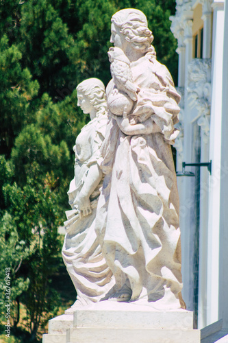 Closeup of the statue front the Carlos Lopes pavilion located in the Eduardo VII park of Lisbon, the hilly coastal capital city of Portugal photo