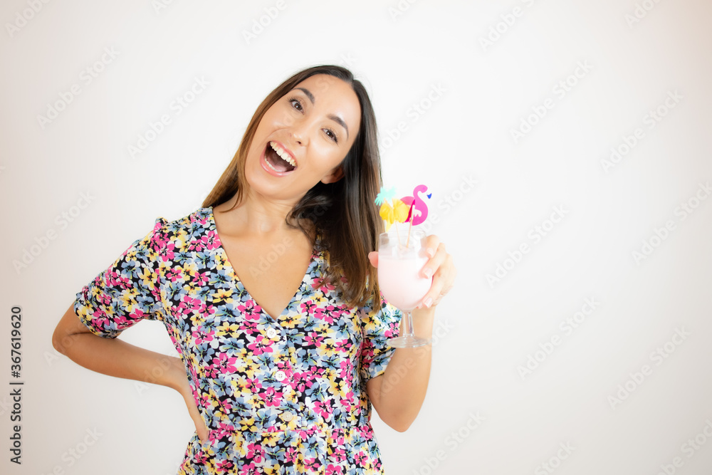 Pretty woman in colorful dress with a cocktail Pretty woman in colorful dress with a cocktail