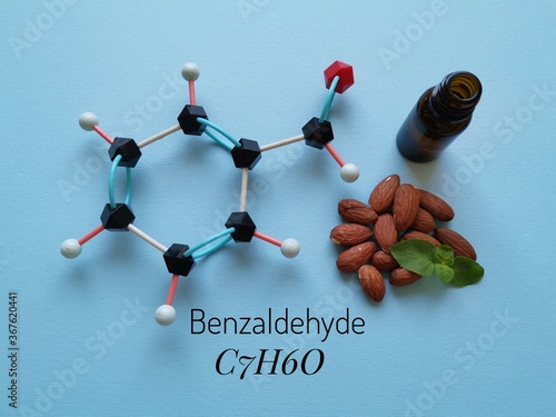 фотографія Molecular structure model of benzaldehyde molecule with almond oil