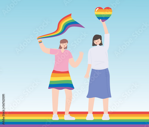 LGBTQ community, young women holding rainbow heart and flag celebration, gay parade sexual discrimination protest