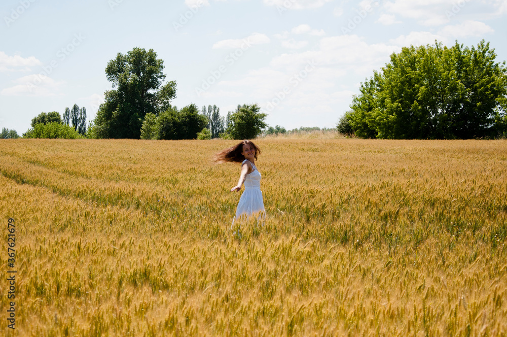 woman dance wheat field. smiling and have fan. feel happiness. Young beautiful woman in romantic dress whirls in field. beautiful bride in wedding dress dancing alone in field on sunset. love story woman dance wheat field. smiling and have fan. feel happiness. Young beautiful woman in romantic dress whirls in field. beautiful bride in wedding dress dancing alone in field on sunset. love story