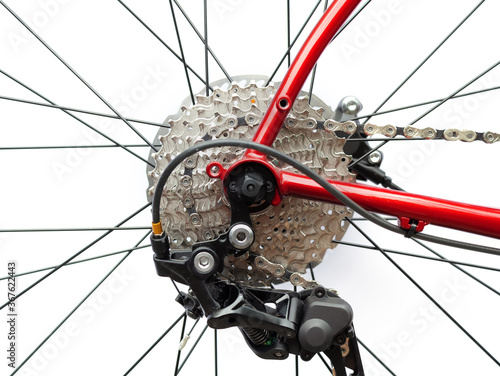 Bicycle cassette and rear derailleur on white background