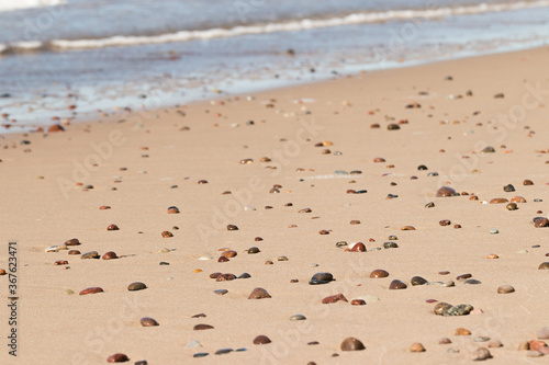 Pebbles on a sandy beach 