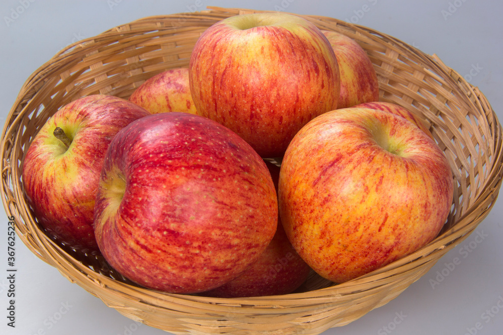 Basket with several apple selected. White background. Basket with several apple selected. White background.