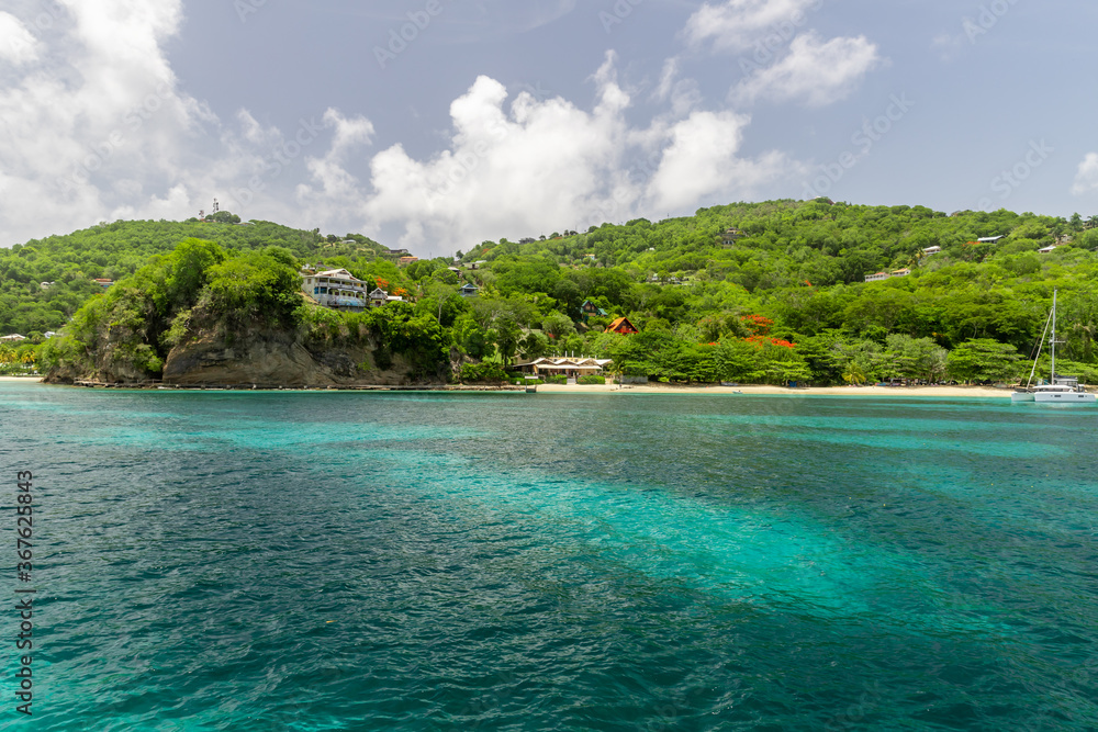 Turquoise water in Admiralty Bay with sailboats and hills in the background, Bequia, Saint Vincent and the Grenadines