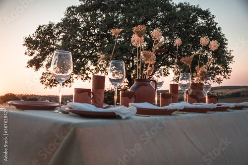 Wedding rustic decorations. Dry summer flowers. Covered festive table. Bride idea. Decoration table.