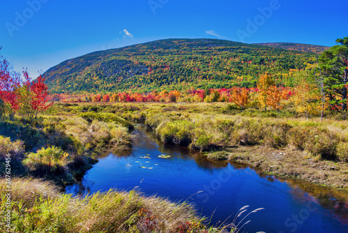 Amazing foliage reflections on a lake. Autumn in New England, USA